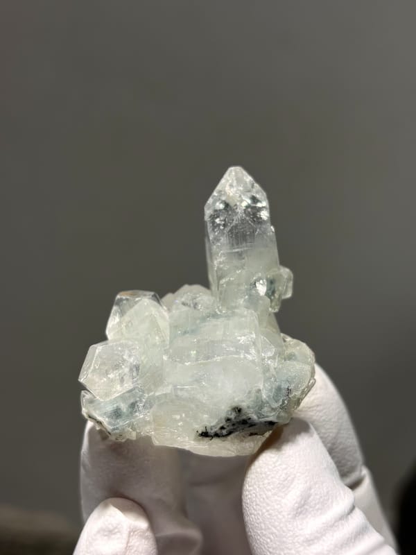 Clear apophyllite pyramid on white cluster from India, second angle