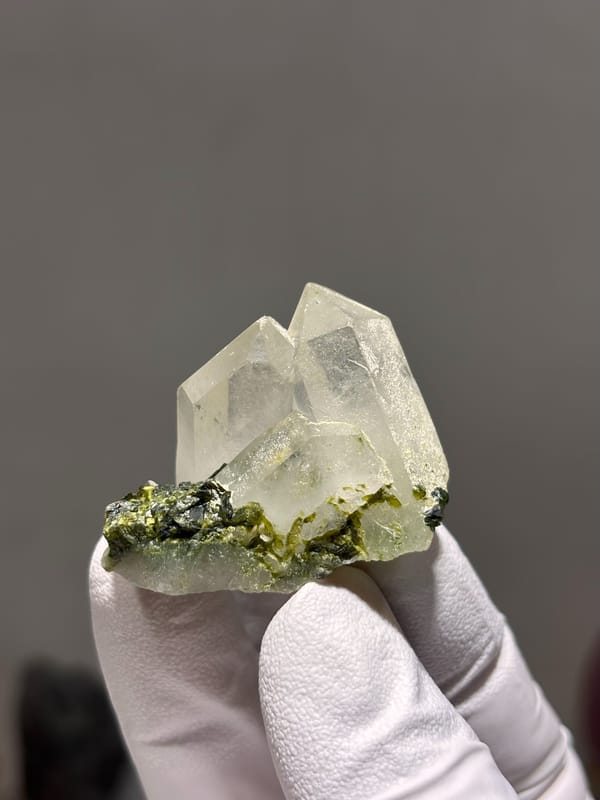 Two clear quartz points with green epidote from Sichuan, China, reverse side