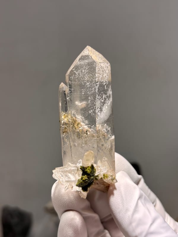 Clear quartz point with green epidote inclusion from Sichuan, China, second angle