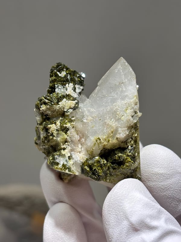 Milky quartz point on dark green epidote base from Sichuan, China, second angle