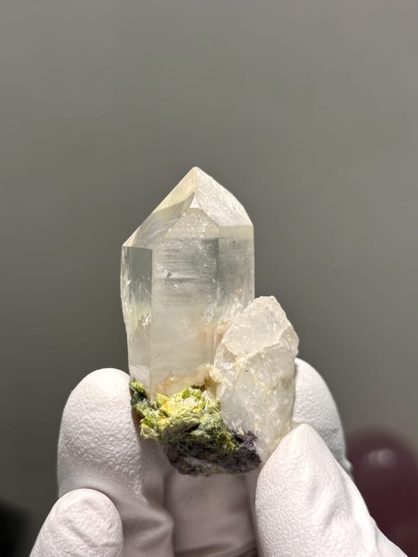 Clear quartz point on green epidote base from Sichuan, China, second angle