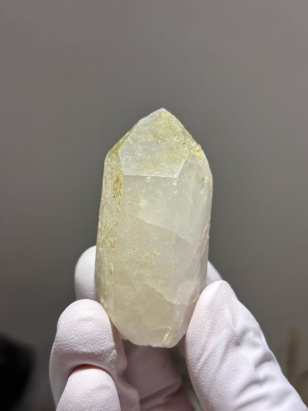 Milky quartz point with green epidote on its face from Sichuan, China, reverse side
