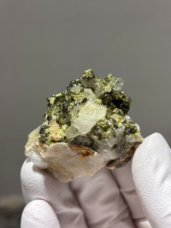 Green epidote with clear quartz on white matrix from Sichuan, China, second angle