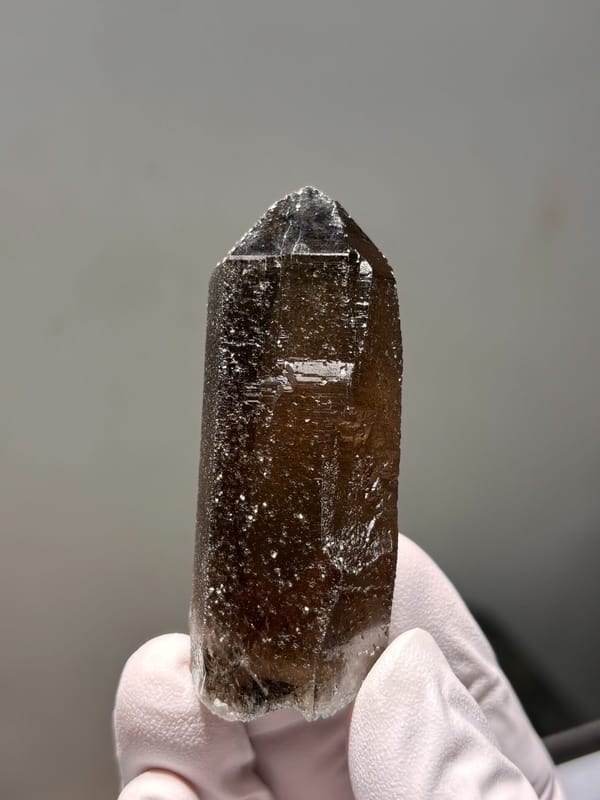 Dark smoky quartz point with sparkling flecks from Fujian, China, second angle