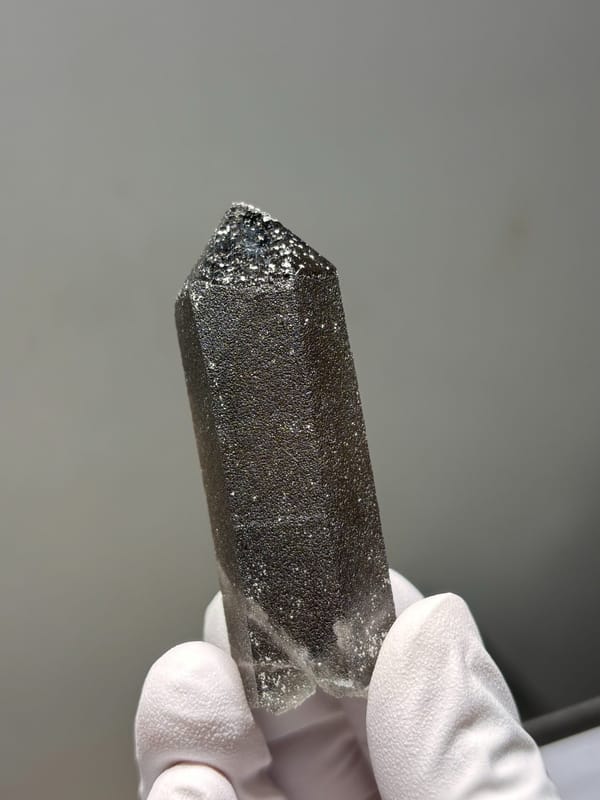Dark smoky quartz point with sparkling flecks from Fujian, China, reverse side