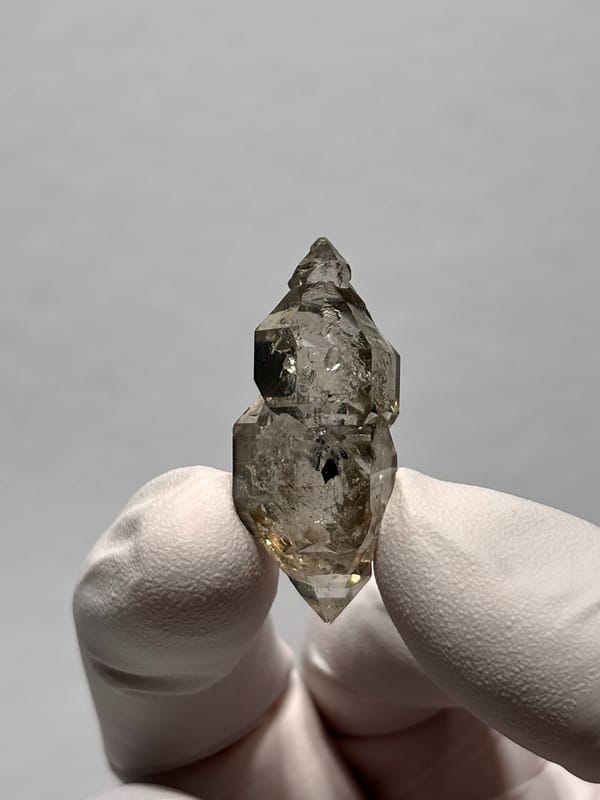 Smoky double-terminated quartz with sceptre tip from Yunnan, China, close-up of the crystal faces