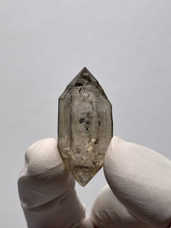 Smoky double-terminated quartz with phantom from Yunnan, China, close-up of the crystal faces