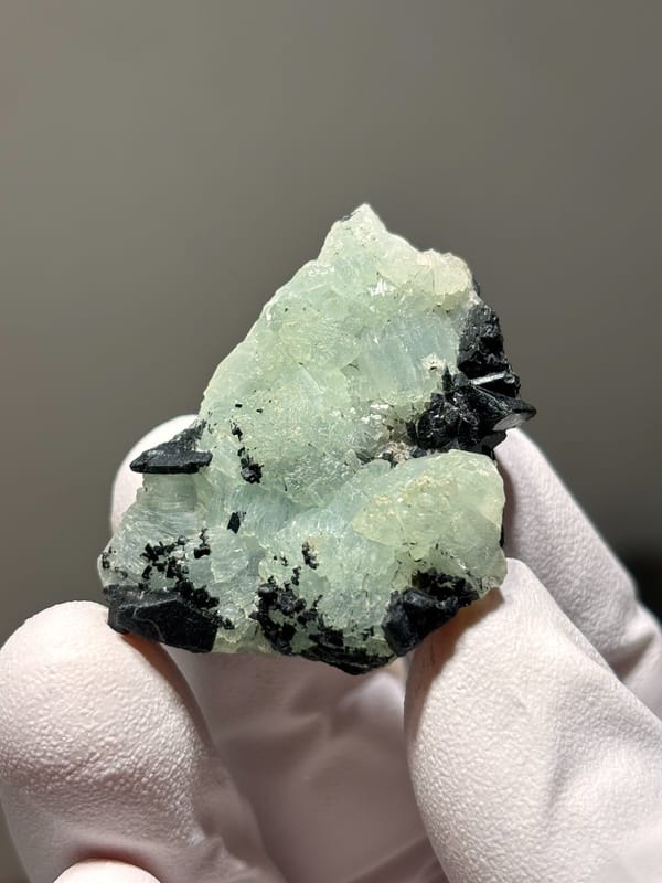 Pale green prehnite with black babingtonite from Yunnan, China, second angle