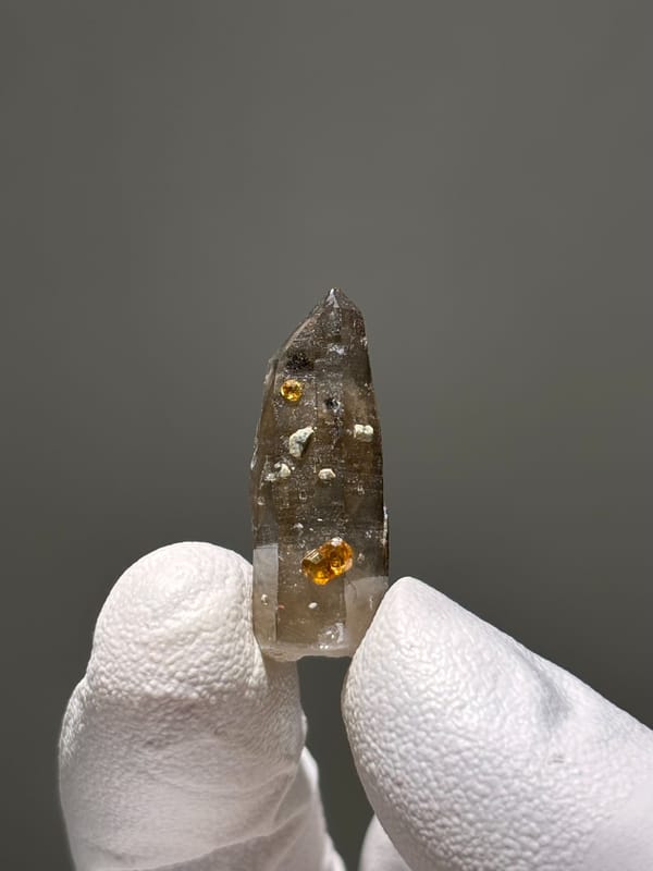 Tiny smoky quartz with Fanta-orange spessartine from Fujian, China, second angle