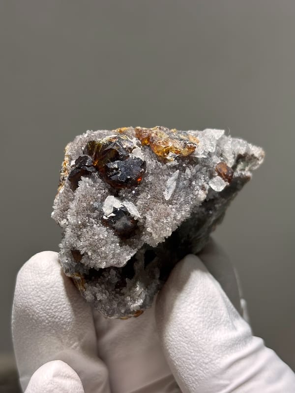 Dark red-brown sphalerite crystals on grey quartz from Hubei, China, second angle