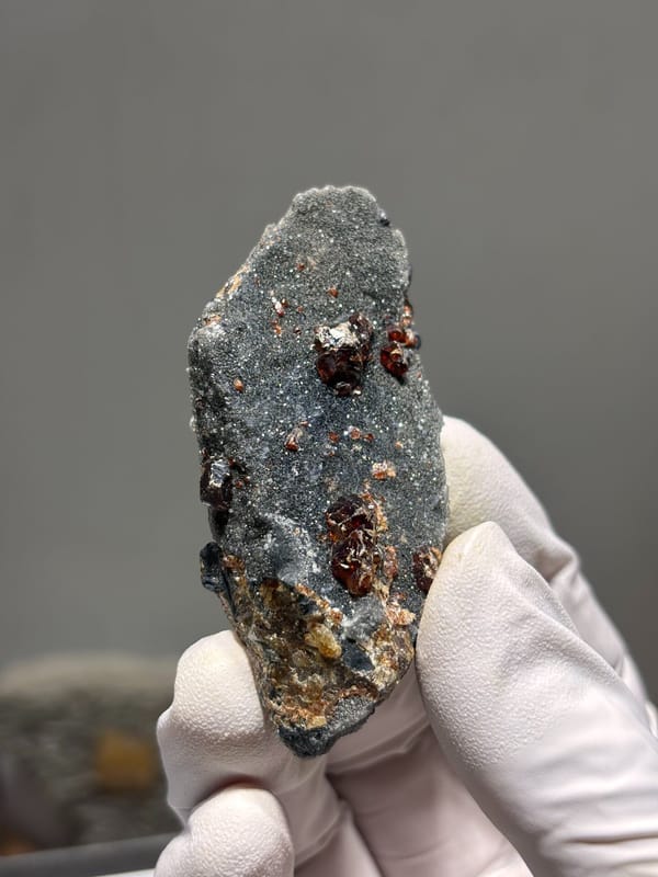Red-brown sphalerite crystals on grey plate from Hebei, China, second angle