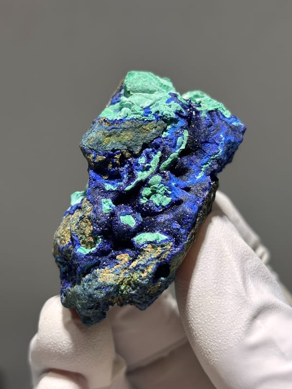 Royal-blue azurite nodule with green malachite from Hubei, China, close-up of the crystal faces