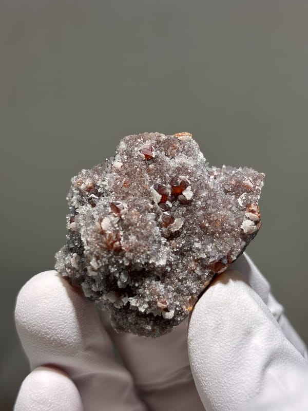 Red-brown sphalerite crystals on white quartz druse from Hubei, China, second angle