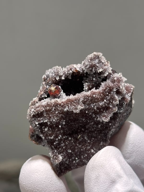 Red-brown sphalerite crystals on white quartz druse from Hubei, China, reverse side