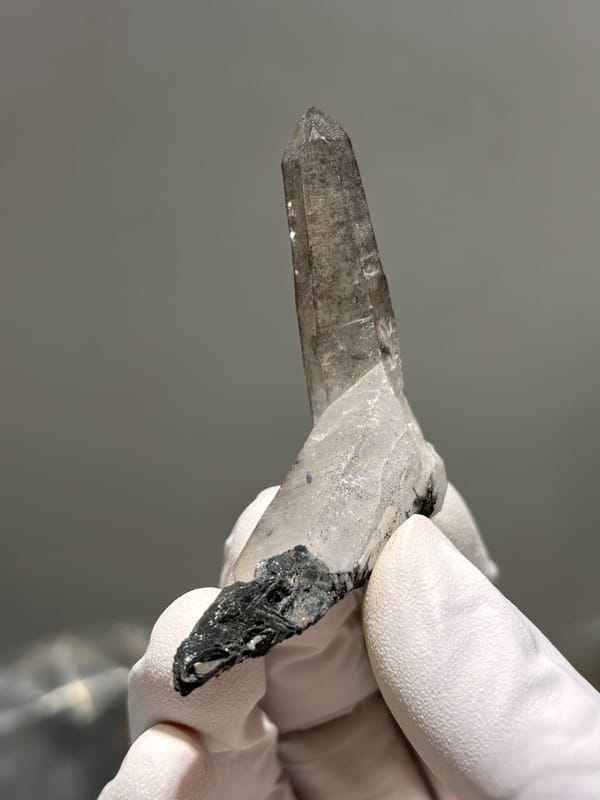 Smoky quartz point on specular hematite base from Guangdong, China, second angle