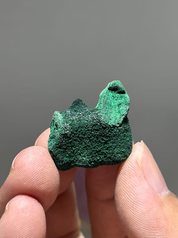 Tiny velvet malachite nodule with silky sheen from Guangdong, China, second angle