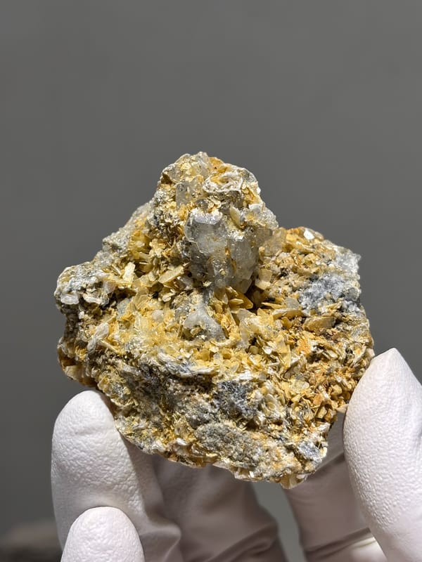 Black cassiterite crystal with aquamarine and mica from Xuebaoding, Sichuan, China, reverse side
