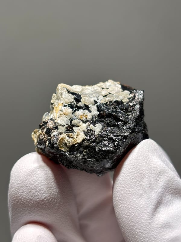 Black cassiterite with white calcite like a snow mountain from Xuebaoding, Sichuan, China, second angle