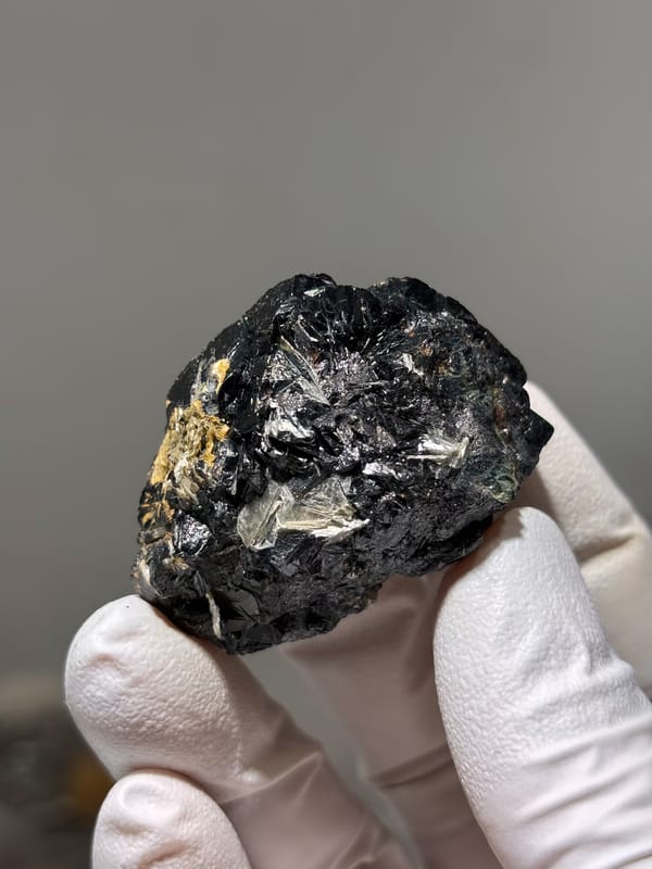 Black cassiterite crystal group with mica from Xuebaoding, Sichuan, China, second angle