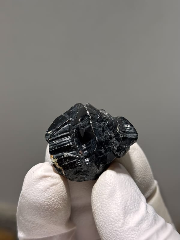 Black cassiterite crystal with bright faces from Xuebaoding, Sichuan, China, second angle