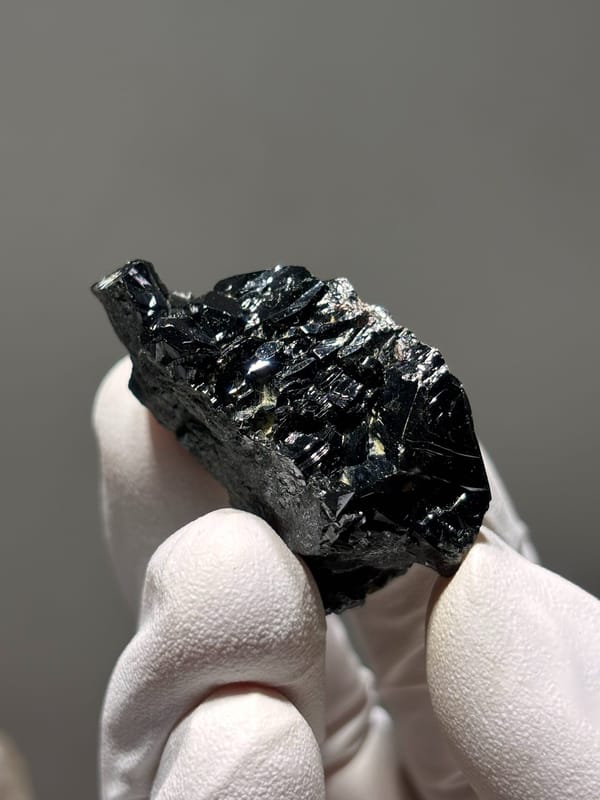 Black cassiterite crystal group from Xuebaoding, Sichuan, China, second angle