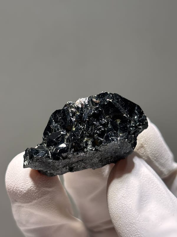 Black cassiterite crystal group from Xuebaoding, Sichuan, China, reverse side