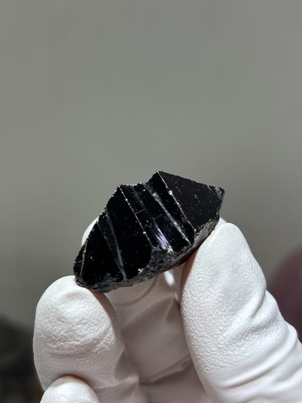 Glossy black cassiterite crystal from Xuebaoding, Sichuan, China, second angle