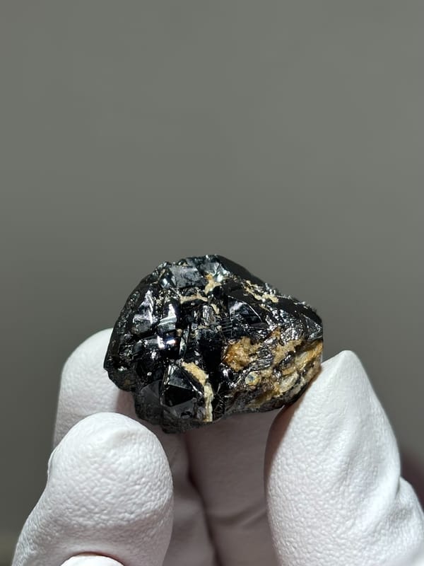 Glossy black cassiterite crystal from Xuebaoding, Sichuan, China, top view