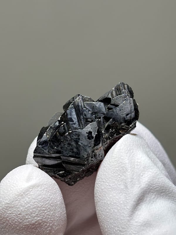 Sharp black cassiterite crystal group from Xuebaoding, Sichuan, China, close-up of the crystal faces