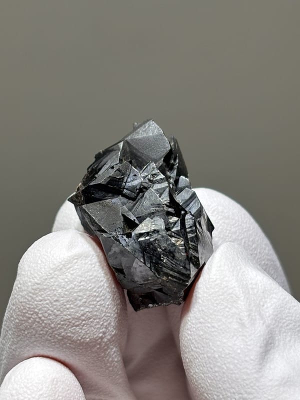 Sharp black cassiterite crystal group from Xuebaoding, Sichuan, China, reverse side