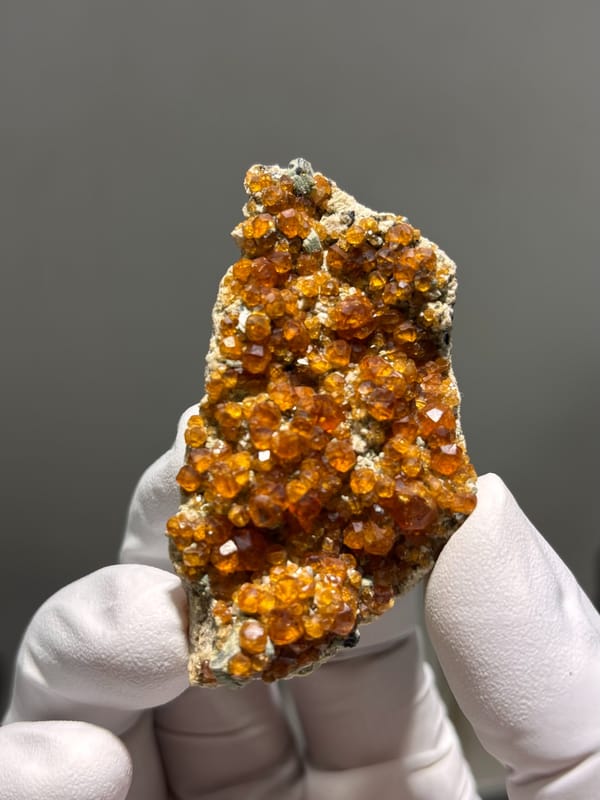 Plate of Fanta-orange spessartine on feldspar from Fujian, China, second angle