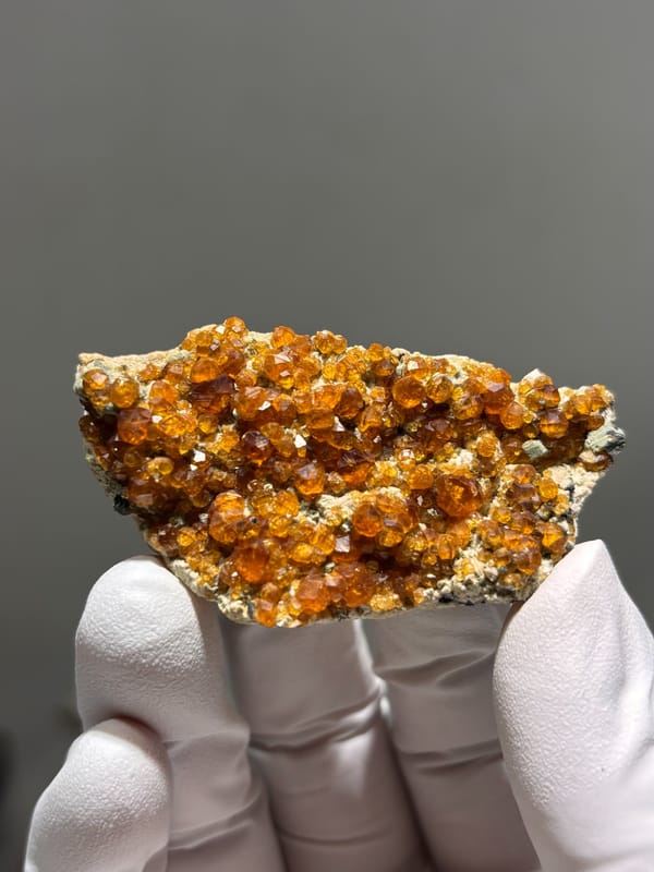 Plate of Fanta-orange spessartine on feldspar from Fujian, China, reverse side