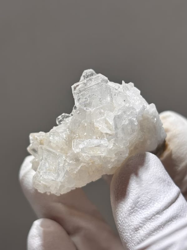 Cluster of clear baryte blades with quartz from Sichuan, China, reverse side