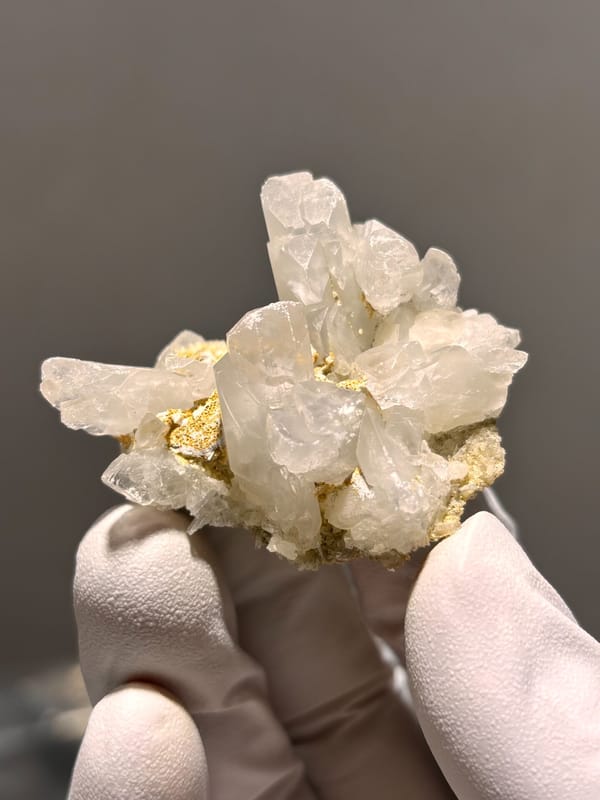 Cluster of clear baryte blades with golden staining from Sichuan, China, second angle