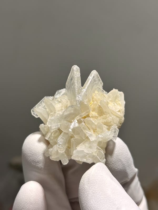 Cluster of cream baryte crystals from Sichuan, China, close-up of the crystal faces