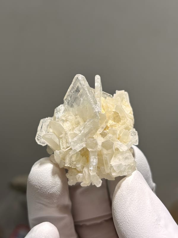 Cluster of cream baryte crystals from Sichuan, China, reverse side