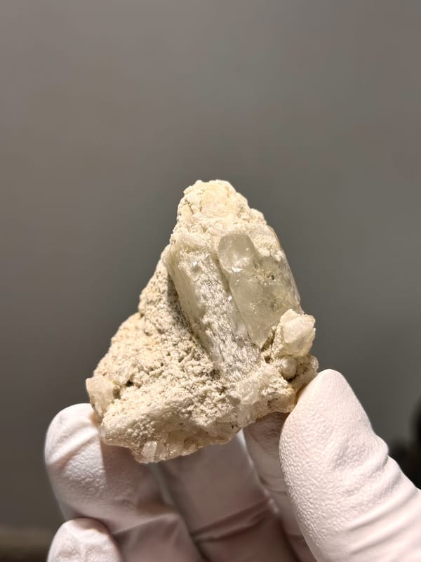Cream baryte crystal in sandy matrix from Sichuan, China, second angle