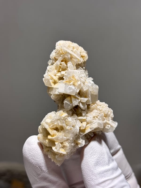 Cluster of cream baryte blades from Sichuan, China, close-up of the crystal faces
