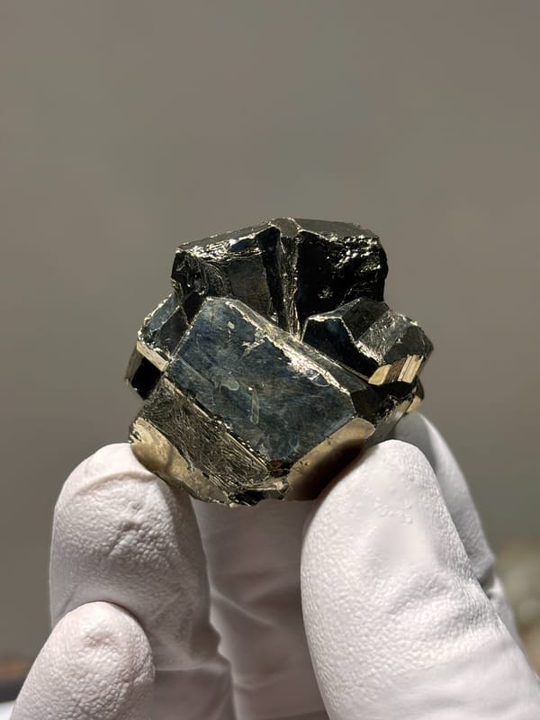 Brassy pyrite crystal ball from Indonesia, close-up of the crystal faces