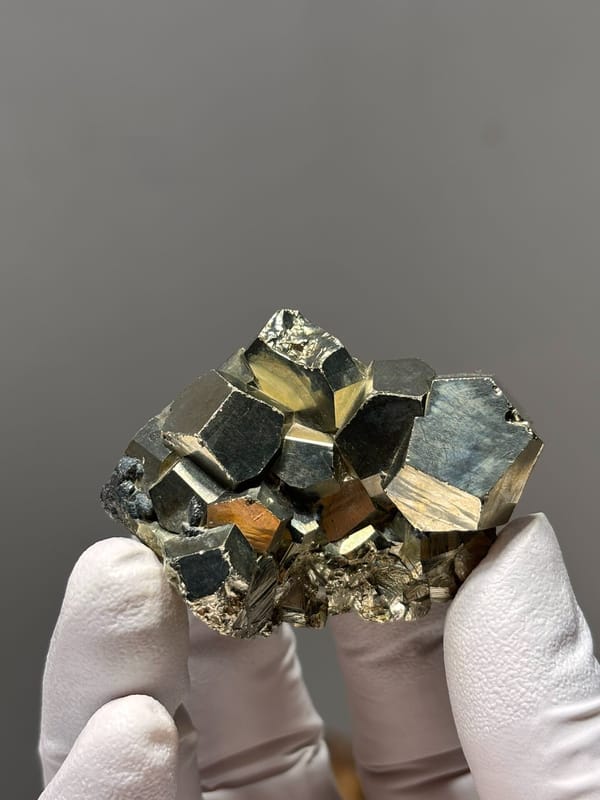 Brassy pyrite cube cluster from Indonesia, close-up of the crystal faces