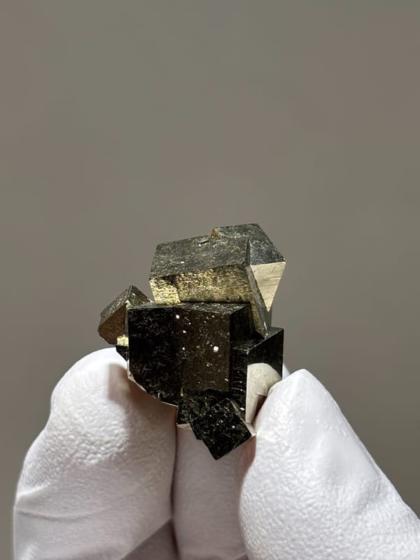 Tiny cluster of intergrown pyrite cubes from Hubei, China, top view