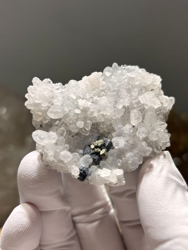 White quartz druse with pyrite and galena from Jiangxi, China, close-up of the crystal faces