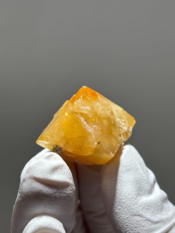 Bright orange scheelite floater crystal from Xuebaoding, Sichuan, China, second angle
