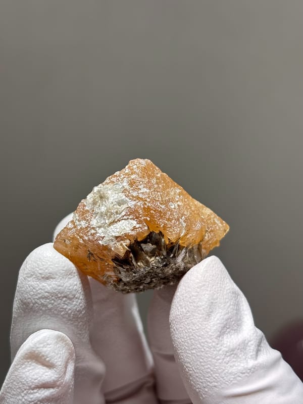 Etched honey scheelite crystal from Xuebaoding, Sichuan, China, close-up of the crystal faces
