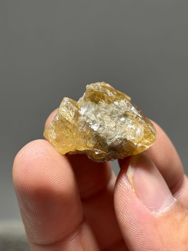 Golden scheelite cluster with mica from Xuebaoding, Sichuan, China, second angle