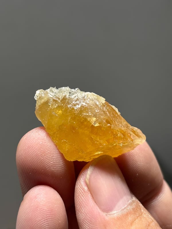 Golden-orange scheelite with floater faces from Xuebaoding, Sichuan, China, second angle