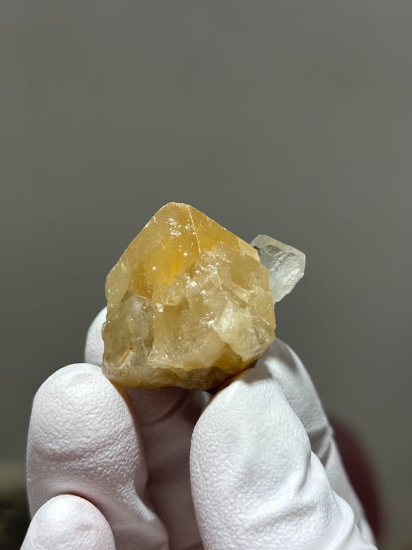 Honey scheelite with small clear aquamarine from Xuebaoding, Sichuan, China, second angle