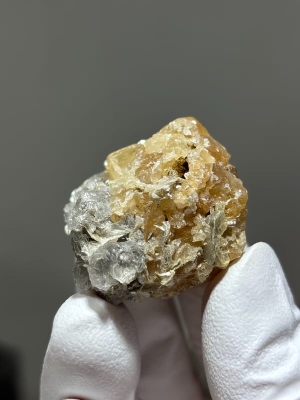 Honey scheelite with clear fluorite from Xuebaoding, Sichuan, China, second angle
