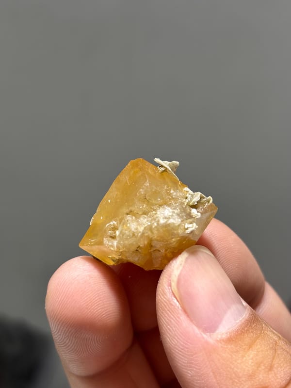 Honey scheelite floater with mica from Xuebaoding, Sichuan, China, second angle