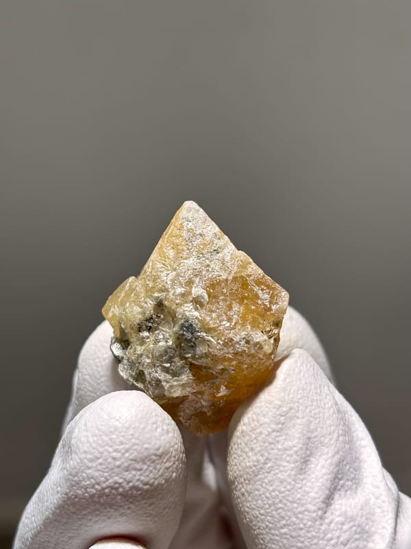 Honey scheelite crystal with mica from Xuebaoding, Sichuan, China, second angle